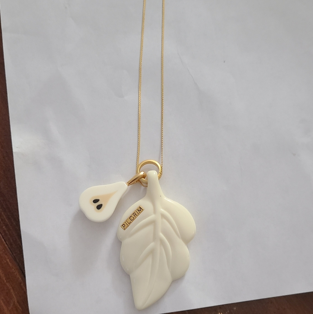 Pilgrim cream leaf/apple gold tone long necklace, NWT.